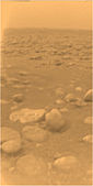 Pebbled plains of Saturn's moon Titan (photographed by Huygens probe, January 14, 2005) composed of heavily compressed states of water ice. This is the only ground-based photograph of an outer Solar System planetary surface