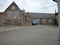 View of the building showing the old bike sheds and the car park of the Braxfield Campus.