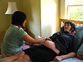 Midwife visiting client at home