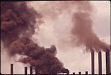 Smoke billows from a dozen industrial chimneys