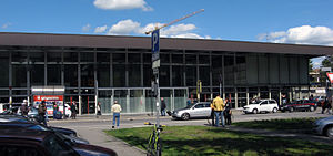 Wide rectangular building with glass front