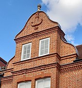 "curly pedimented gables ... a little Dutch"[4]