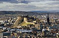 Image 18Edinburgh Castle is a fortress which dominates the skyline of the city of Edinburgh, from its position atop the volcanic Castle Rock. Human habitation of the site is dated back as far as the 9th century BC, although the nature of early settlement is unclear. There has been a royal castle here since at least the reign of King David in the 12th century, and the site continued to be a royal residence until the Union of the Crowns in 1603.