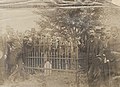 1889 photograph of John Sevier's original grave at Fort Decatur prior to disinterment. Tennessee governor Robert Love Taylor is leaning on the left corner of the fence and Alabama governor Thomas Seay is leaning on the right corner.