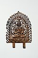 Bodhisattva aux mains jointes. Plaque bordée de flammes ajourées. Bronze doré, H. 24 cm, v. 680[27]