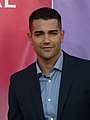Crew cut: top, short; back/sides, short taper; sideburns, semi-short; short pomp (pompadour) front, arched; mid top, rounded; crown, rounded; front hairline, slightly asymmetric with a cow lick at off center right; wavy hair. Jesse Metcalfe.