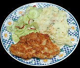 Kotlet z indyka turkey cutlet with spring onion mashed potato, cucumber and radish salad.