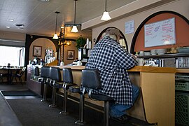 A man eating lunch at a lunch counter