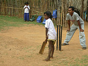 Cricket is the most popular game among India's masses. Shown here is an instance of street cricket.