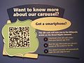 A label in The Children's Museum of Indianapolis that uses a QRpedia code to direct visitors to the Wikipedia article "Broad Ripple Park Carousel"