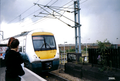 It is a picture of a Anglia Railways train in Willesden Junction during 2000.