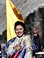 buddhist girl dancing on a folk song