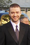 Justin Timberlake in a suit smiling.