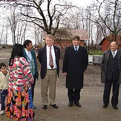 United States ambassador Thomas B. Robertson visiting the Romani settlement of Kerinov Grm (2005)