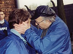 elderly survivor comforting a young boy