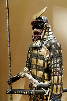 Karuta tatami dō gusoku, Edo period. A lightweight portable folding (tatami) armour made from small square or rectangle armor plates called karuta. The karuta are usually connected to each other by chainmail and sewn to a cloth backing.