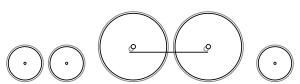Diagram of two small leading wheels, two large driving wheels joined by a coupling rod, and one small trailing wheel