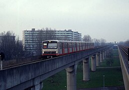 The older LHB M3 rolling stock arrining at Kraaiennest station (1992)