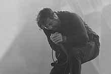 Chino Moreno screaming in a microphone