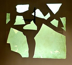 Fragment of a Roman window glass plate dated to 1st to 4th century CE. Note the obvious curvature; this is not a flat pane
