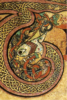 Detail of initial "T" with ribbon interlace filling and interlaced animal motif