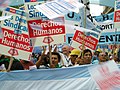 Image 49Union members march in Argentina on Human Rights Day in December 2005. The signs read "Worker rights are human rights..