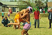 As a part of the Yaosang sports festival, old folks show off their skill in a traditional form of wrestling known as mukna. These two gentlemen were more than 80 years old.