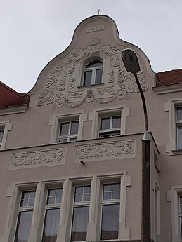 Adorned balcony and gable