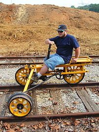 Three-wheeled handcar designed to be operated by a single person, widely known in the United States as a handcar or velocipede