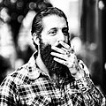 Image 88A man with sleeve tattoos, beard and flannel shirt, mid 2010s (from 2010s in fashion)