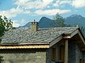 Image 27Alpine chalet being built in Haute-Maurienne (Savoy), the use of thick pieces of orthogneiss (4–7 cm) is by the strict architectural regulations in the region bordering the national parks of Vanoise-Grand Paradis. (from Alps)