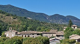 A view of Sainte-Euphémie-sur-Ouvèze, with the church of Sainte-Euphémie to the right and the Protestant temple to the left