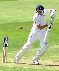 Joe Root playing a shot