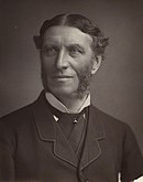 Monochrome photograph of the poet Matthew Arnold with centre parting and sideburns