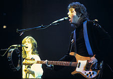 Jimmy McCulloch and Paul McCartney performing during the Wings Over the World tour in 1976
