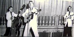 Smith on stage at the Ellis Auditorium, Memphis, circa 1956, with Marcus Van Story (l) and Al Hopson (r).