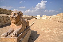 Limestone recumbent lion statue at the temple in Medinet Madi