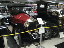 Red-painted Model C on display in a museum