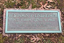 Grave of Benjamin Franklin Lindheimer. A green copper/bronze plaque depicting his name and dates of birth and death followed by the message "beloved husband of Vera and devoted father - you will live in our hearts forever"