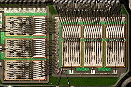 Detail of the inside of a Mitsubishi Electric CM600DU-24NFH IGBT module rated for 600 A 1200 V, showing the IGBT dies and freewheeling diodes