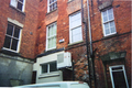 A picture of a Fujitsu Air conditioning unit at a Banbury shopping mall in the year 2010. The small box above it is a unrelated burglar alarm.