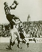 Ron Todd of Collingwood taking a spectacular mark in the 1930s