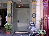 The original door to Club 33 at Disneyland prior to the major 2014 remodel. The new door is more prominently marked and located across from the La Mascarade d'Orleans shop