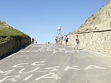 Photograph of a rising road leading to the summit of a mountain