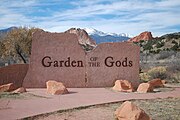 The entrance to Garden of the Gods with Pikes Peak in the background