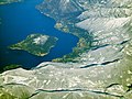 Aerial view of Monte Isola (both Montisola island, Loreto isle and San Paolo isle) and part of the Brescia shore of the Iseo lake in winter