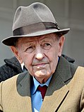 Portrait of Milos Jakes wearing a hat, tie and coat