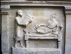 Relief of a slave (at left) in Ancient Rome. The Roman Empire often made POWs into slaves