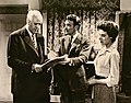 Sim, John Mills and Yvonne Mitchell in 1955 film studio press photograph