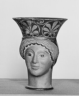 Ancient Greek frieze of big palmettes at the top of a mug in the form of a woman's head, c.500–490 BC, tarracotta, Metropolitan Museum of Art